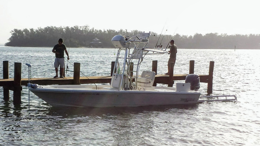 Captain Eric's 26-foot Pathfinder fishing charter boat docked and rigged at sunrise in Sarasota, FL